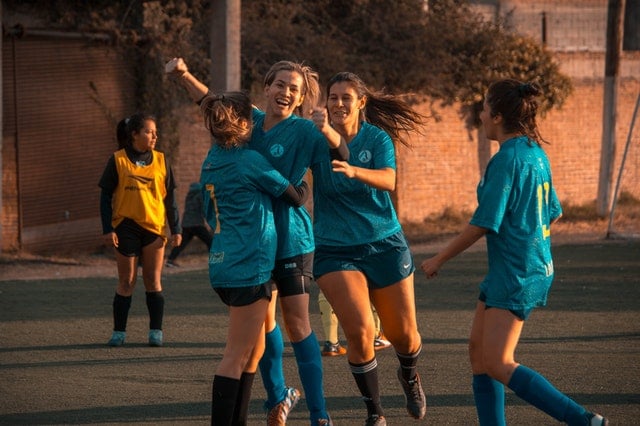 Soccer team celebrating a goal