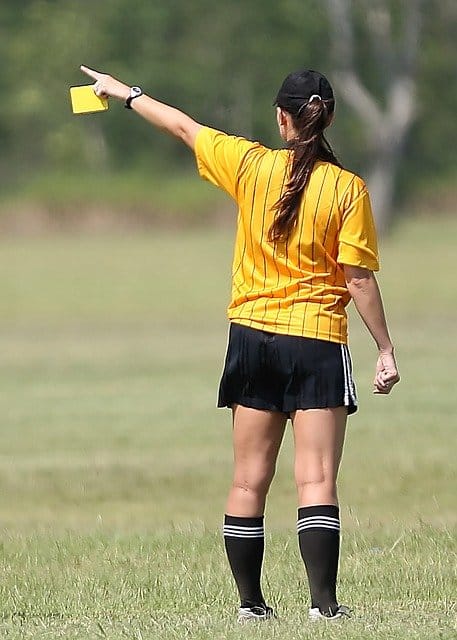 referee with a yellow card