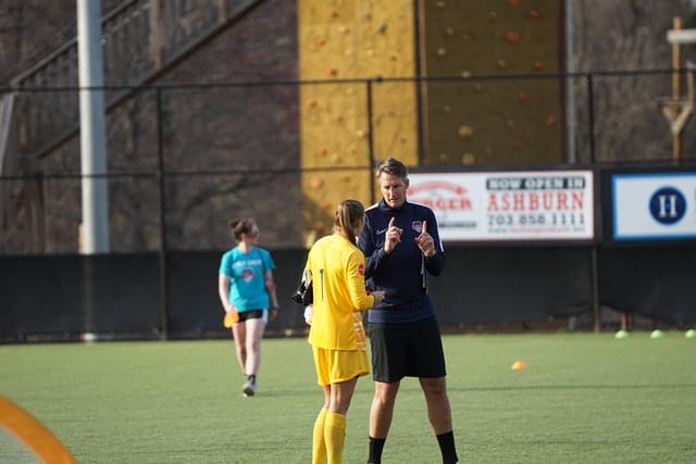 soccer coach talking to a player