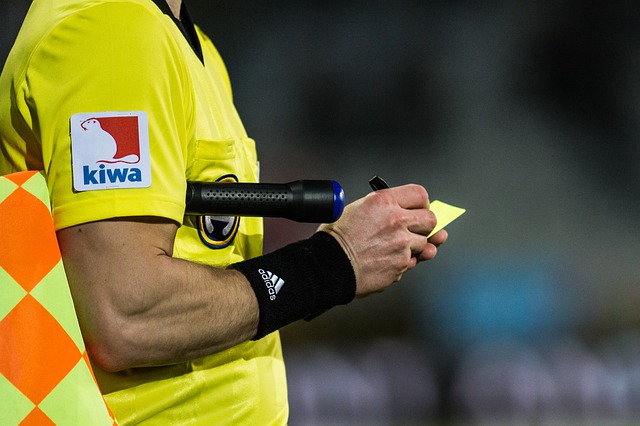 referee with a yellow card