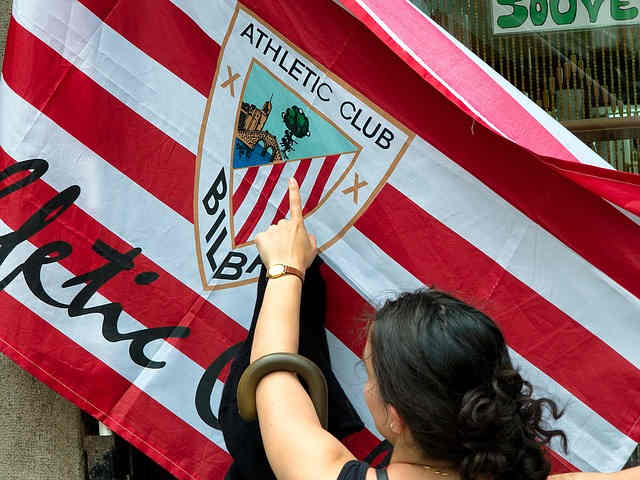 Soccer fan with a club flag